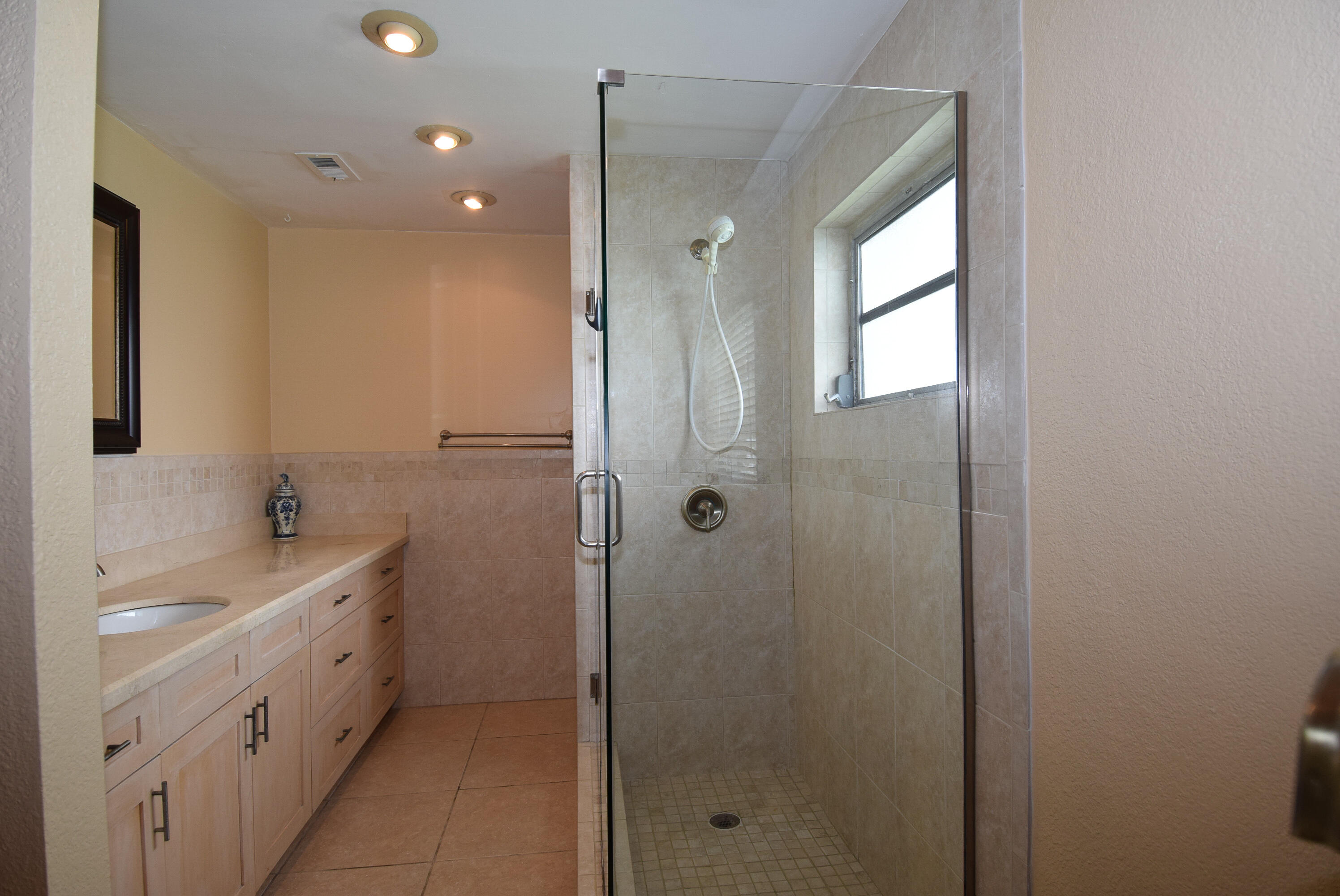 334 3rd Road Key Largo, FL 33037 - Photo 16 of 30 a bathroom with a double vanity sink a toilet and shower