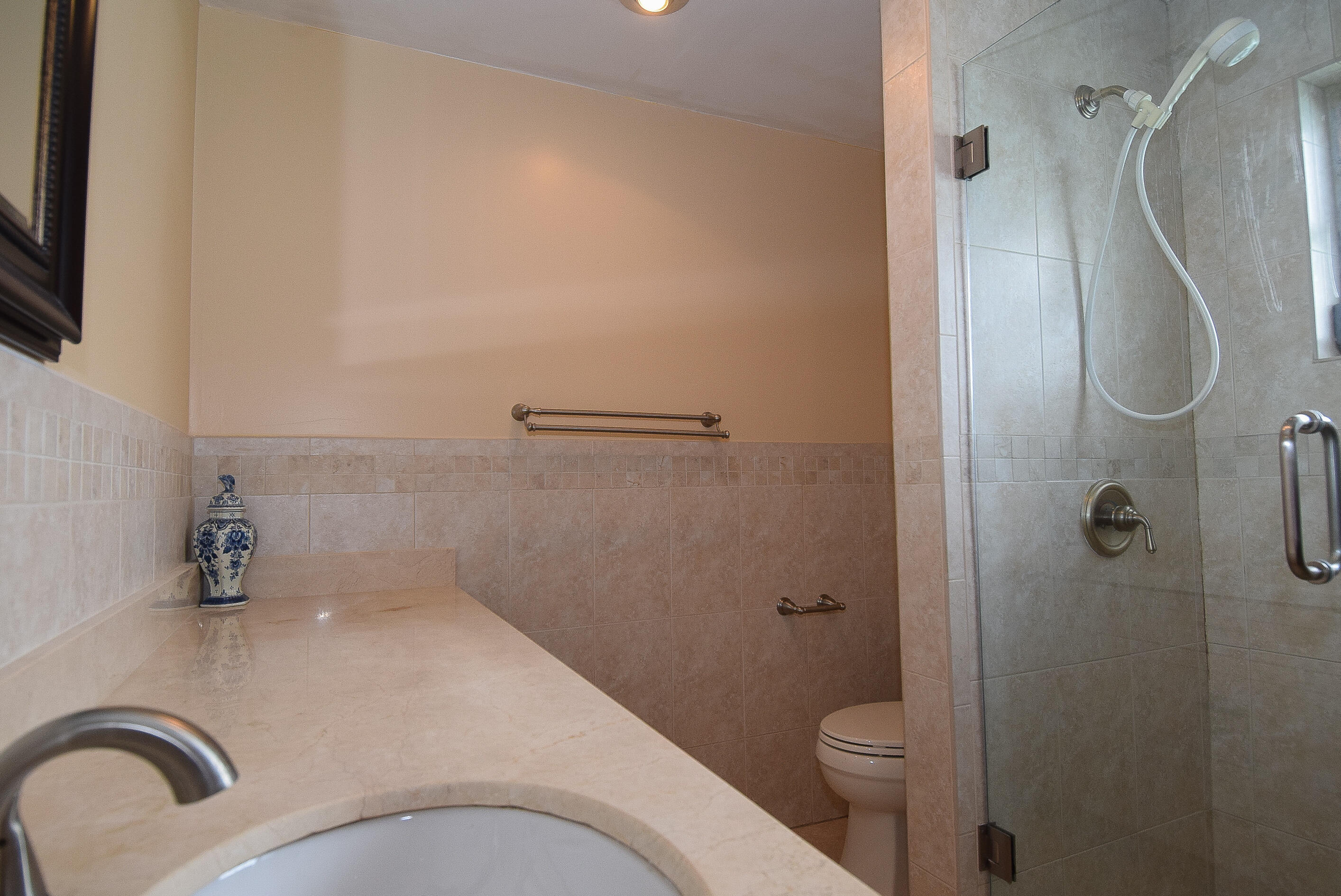 334 3rd Road Key Largo, FL 33037 - Photo 18 of 30 a bathroom with a granite countertop sink toilet and shower