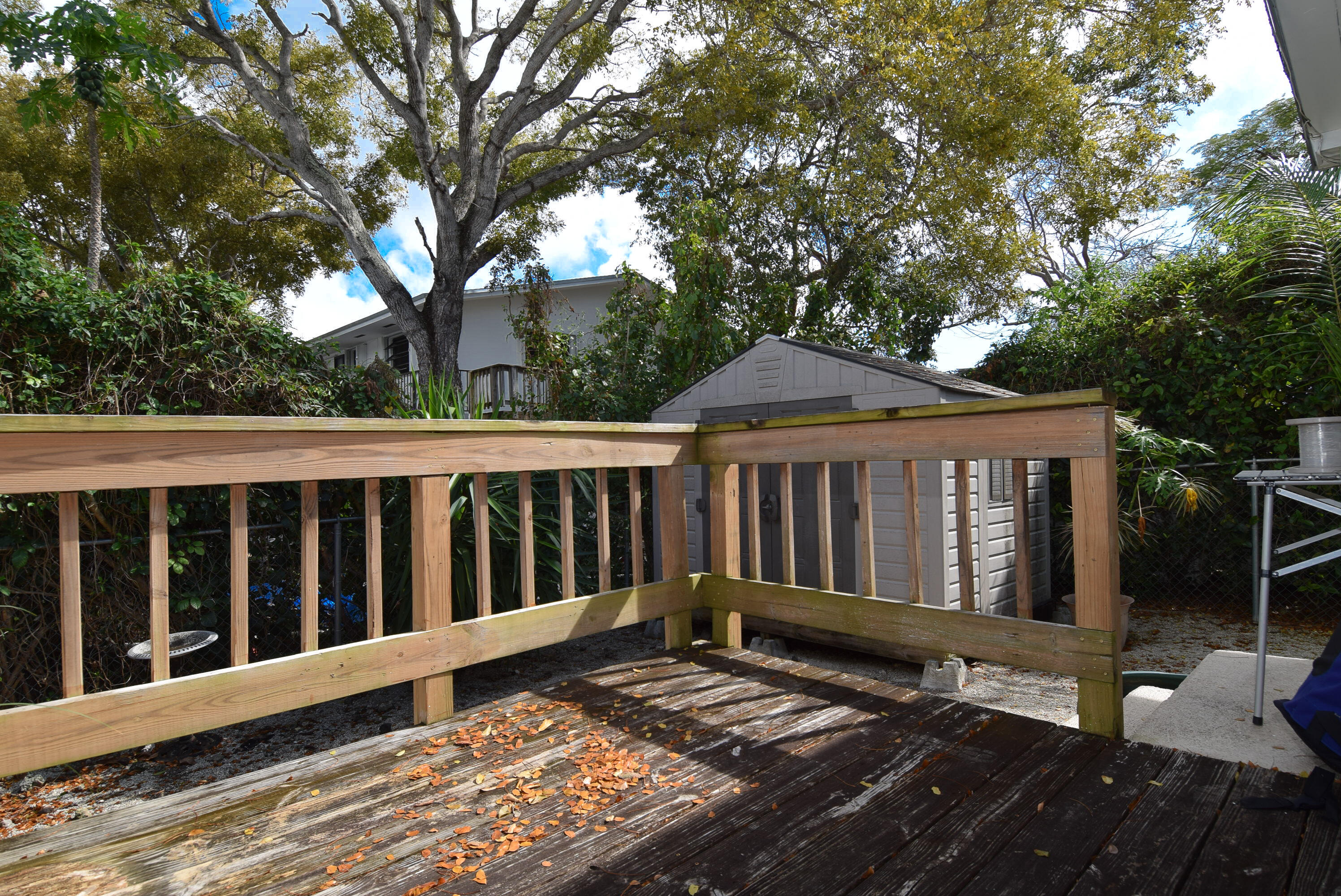 334 3rd Road Key Largo, FL 33037 - Photo 25 of 30 a view of wooden house with a large window and wooden fence