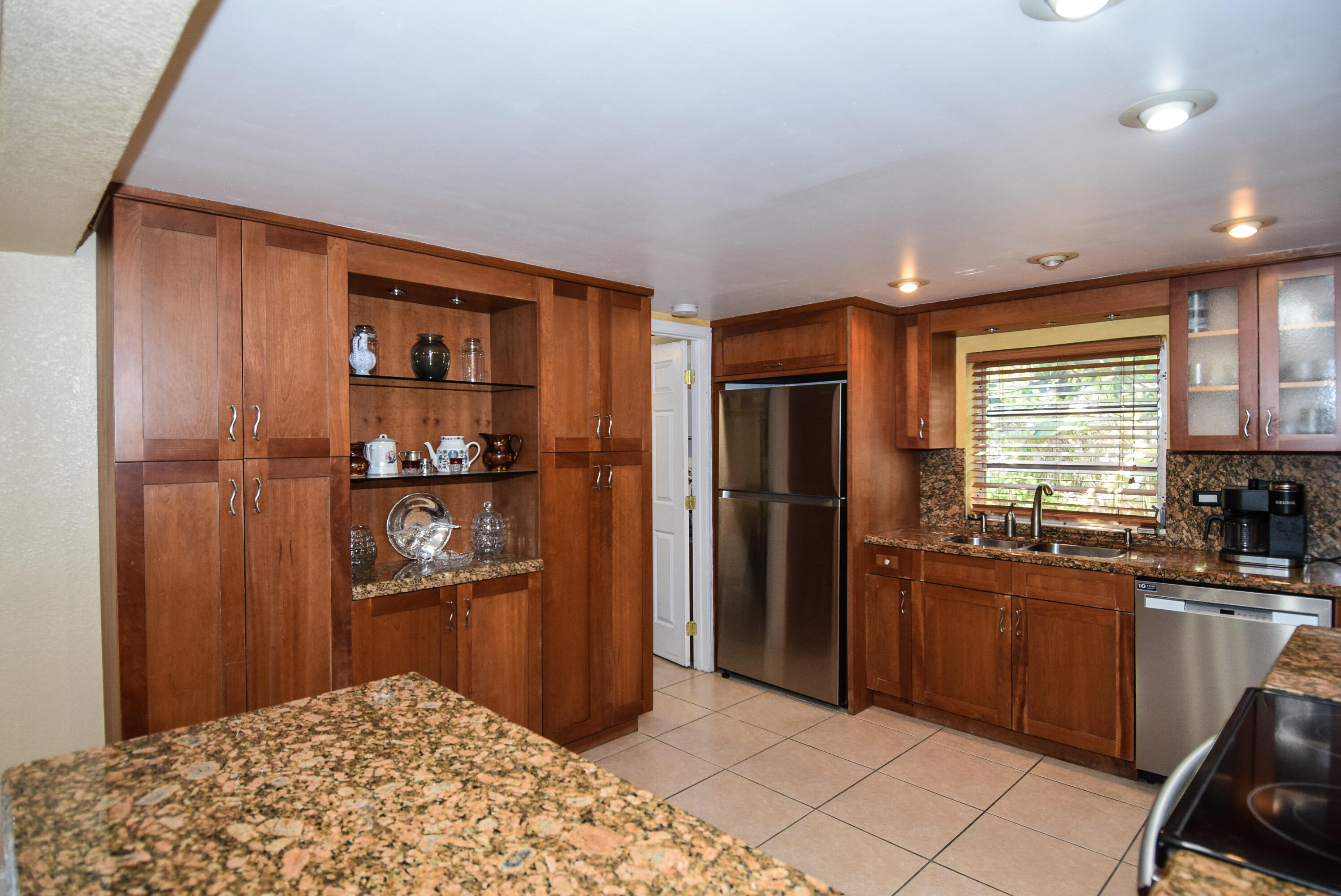 334 3rd Road Key Largo, FL 33037 - Photo 4 of 30 a kitchen with stainless steel appliances granite countertop a refrigerator and a sink