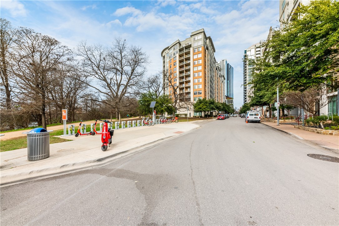a view of street with tall buildings