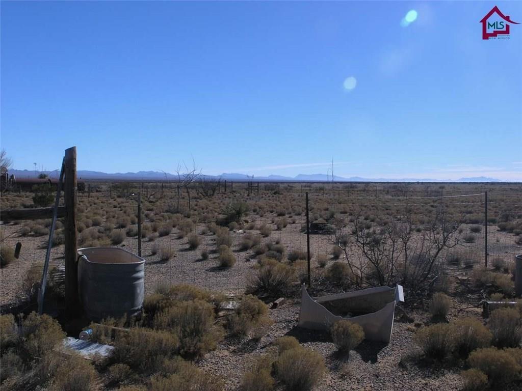 736 Upham Road Elephant Butte, NM 87935 - Photo 11 of 27 a view of a backyard of a house with a mountain