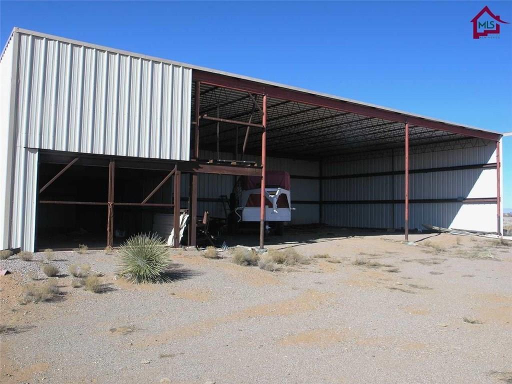 736 Upham Road Elephant Butte, NM 87935 - Photo 13 of 27 front view of a house with a yard