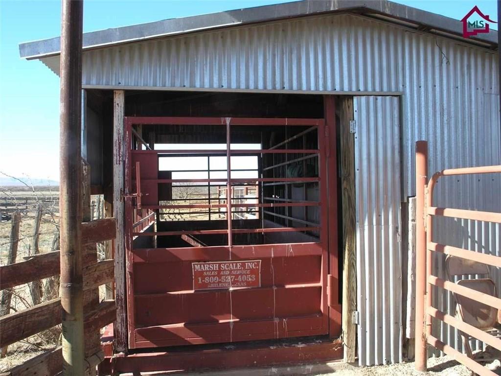 736 Upham Road Elephant Butte, NM 87935 - Photo 17 of 27 a room with water heater and a wooden door