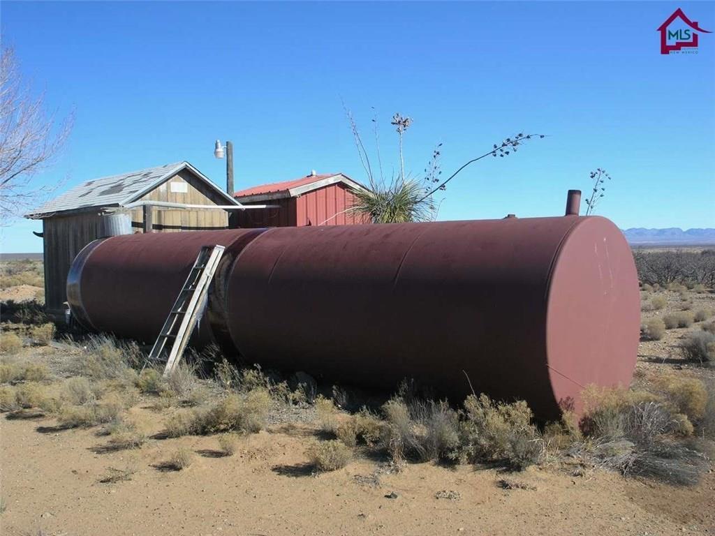 736 Upham Road Elephant Butte, NM 87935 - Photo 19 of 27 a front view of a house with a yard