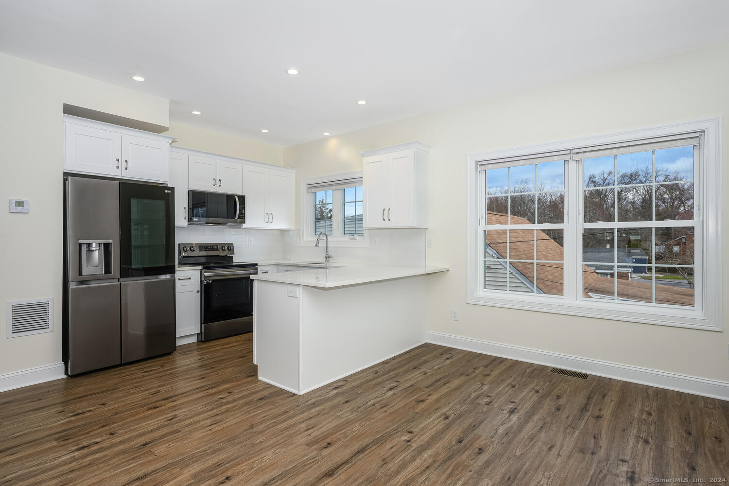 2 Beacon Square, Unit 3 Fairfield, CT 06825 - Photo 11 of 33 A view to the kitchen and sunny dining area which is adjacent to the kitchen.