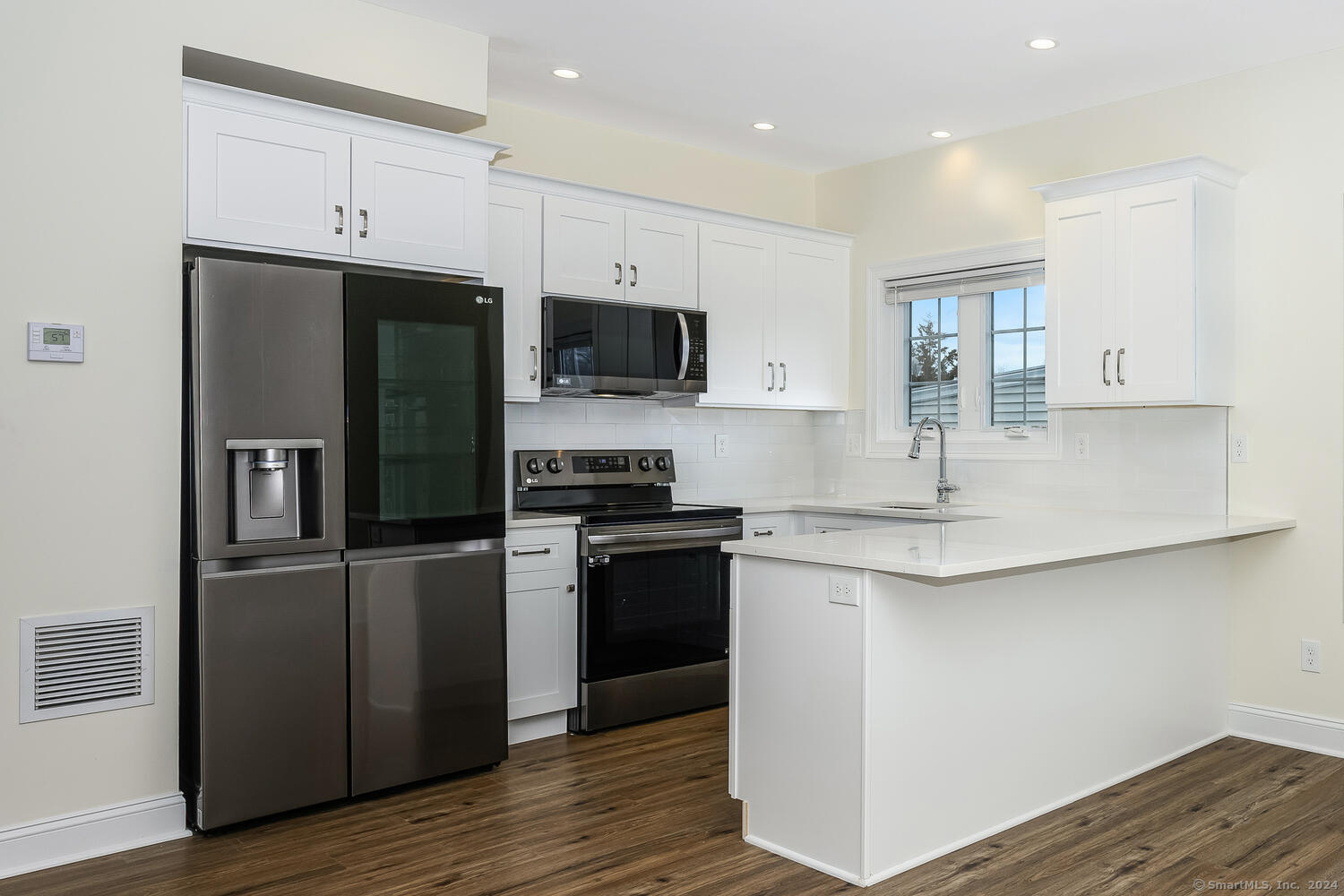 2 Beacon Square, Unit 3 Fairfield, CT 06825 - Photo 12 of 33 Enjoy relaxing at the breakfast bar in your well appointed kitchen.