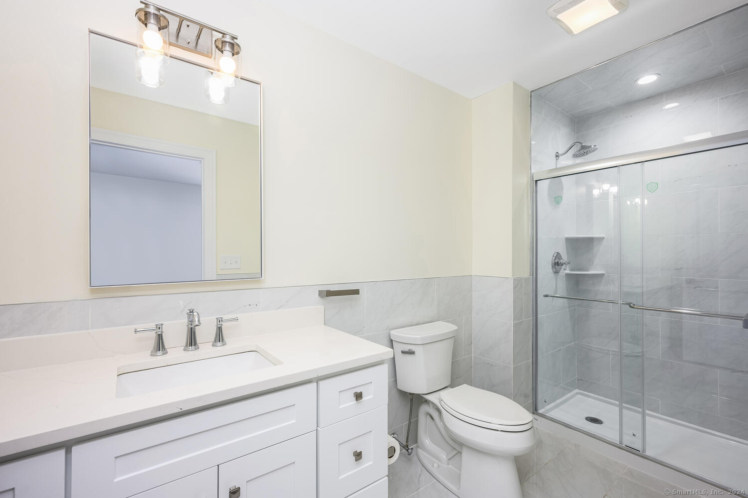 2 Beacon Square, Unit 3 Fairfield, CT 06825 - Photo 20 of 33 This large bathroom boasts a generous shower.