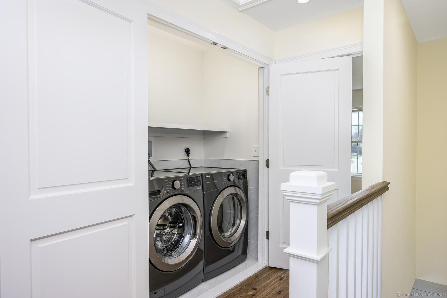 2 Beacon Square, Unit 3 Fairfield, CT 06825 - Photo 28 of 33 The laundry closet has full sized washer and dryer.