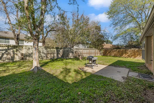 a view of backyard with slide