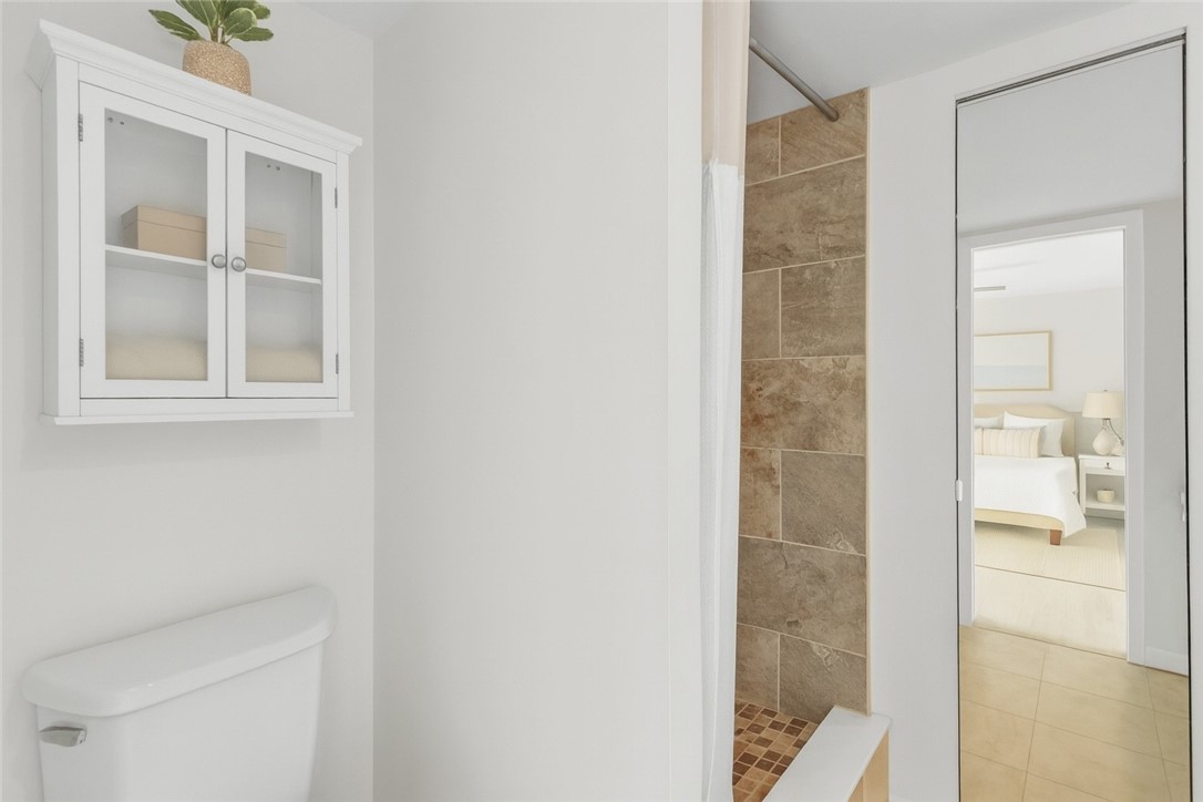 465 East Waverly Place, Unit 8B Vero Beach, FL 32960 - Photo 16 of 28 a bathroom with a shower and a window