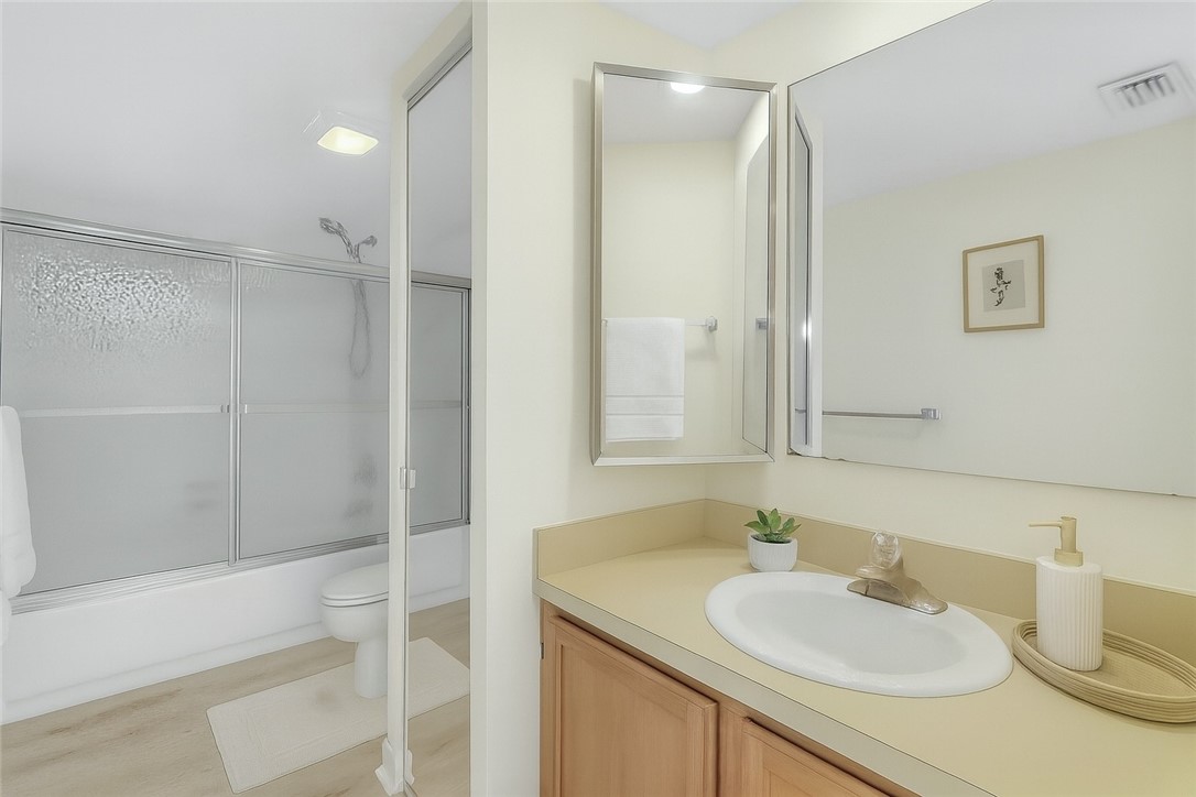 465 East Waverly Place, Unit 8B Vero Beach, FL 32960 - Photo 19 of 28 a bathroom with a sink and a mirror