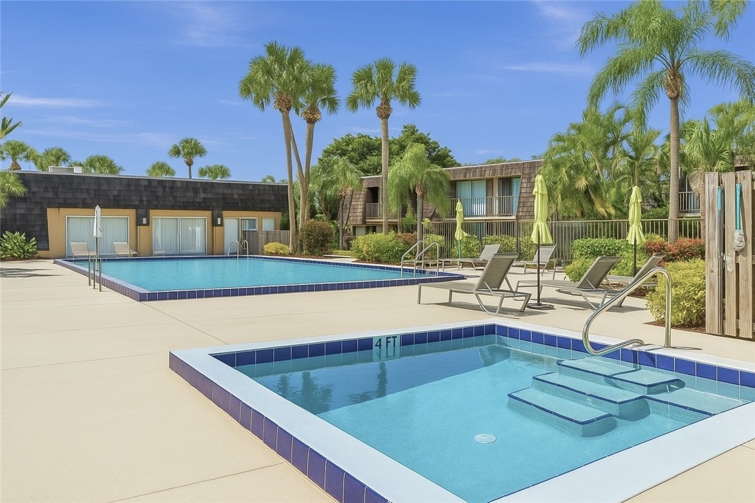 465 East Waverly Place, Unit 8B Vero Beach, FL 32960 - Photo 25 of 28 a view of a house with a swimming pool