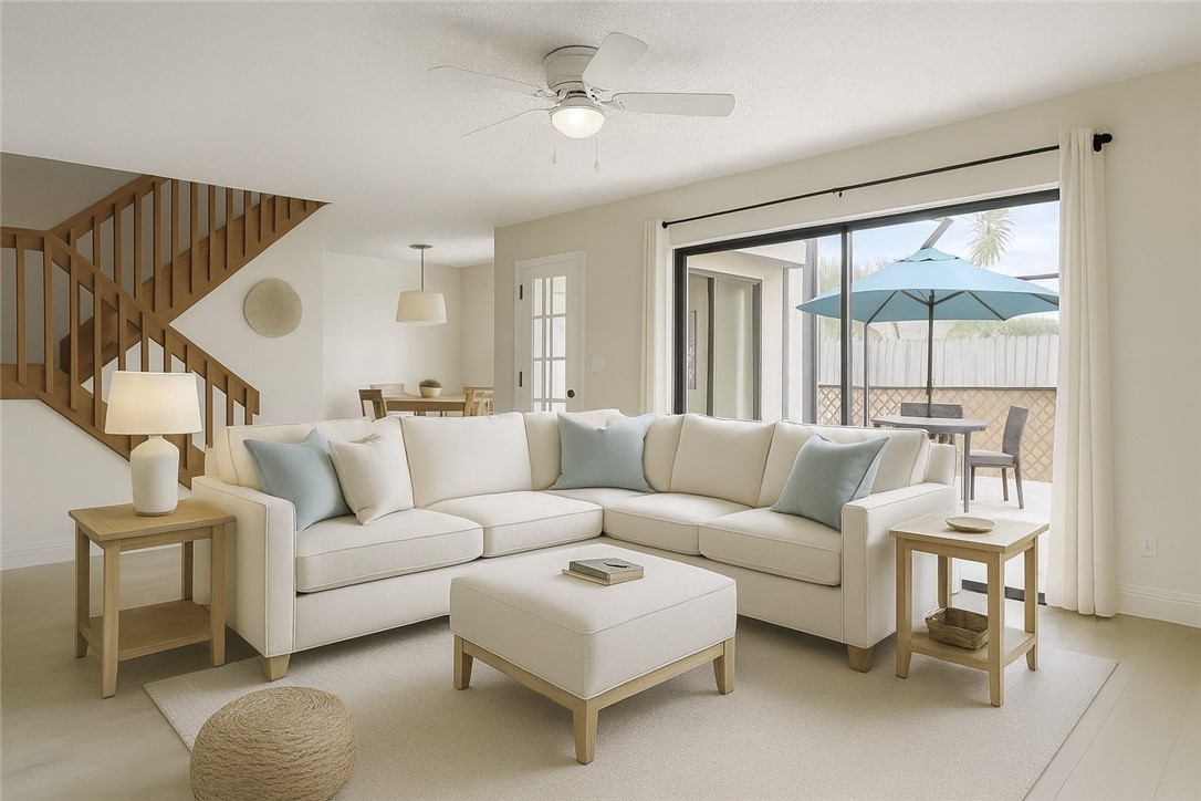 465 East Waverly Place, Unit 8B Vero Beach, FL 32960 - Photo 3 of 28 a living room with furniture and a large window