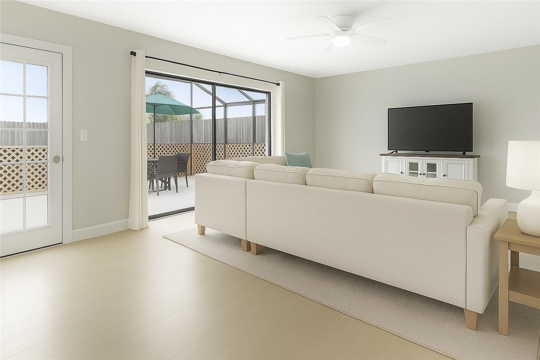 465 East Waverly Place, Unit 8B Vero Beach, FL 32960 - Photo 4 of 28 a living room with furniture and a flat screen tv