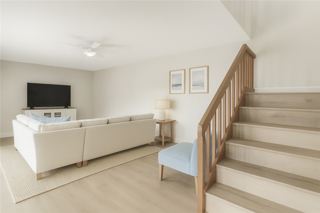 465 East Waverly Place, Unit 8B Vero Beach, FL 32960 - Photo 10 of 28 a view of room with stairs and furniture