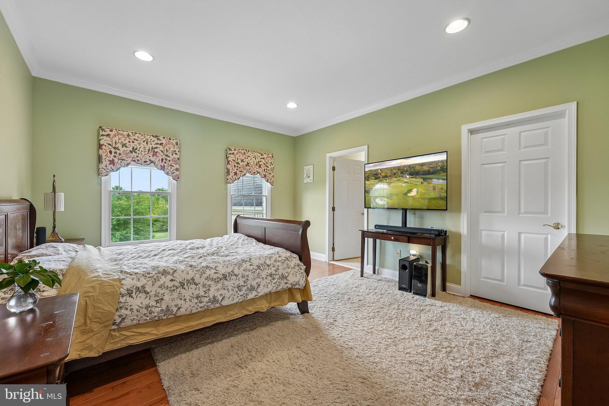 1 Baker Way Pennington, NJ 08534 - Photo 41 of 77 a bedroom with a bed and a flat screen television