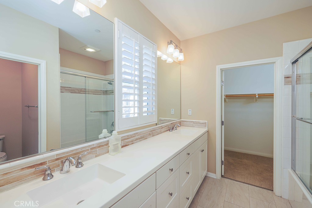 125 Waterleaf Irvine, CA 92620 - Photo 15 of 20 a bathroom with double sink and a mirror