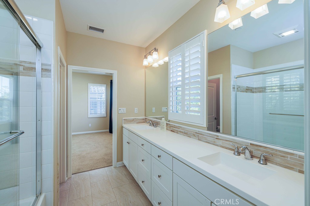 125 Waterleaf Irvine, CA 92620 - Photo 16 of 20 a spacious bathroom with a double vanity sink mirror and double