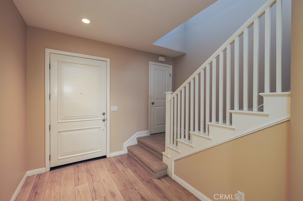 125 Waterleaf Irvine, CA 92620 - Photo 5 of 20 a view of staircase with white walls and railing