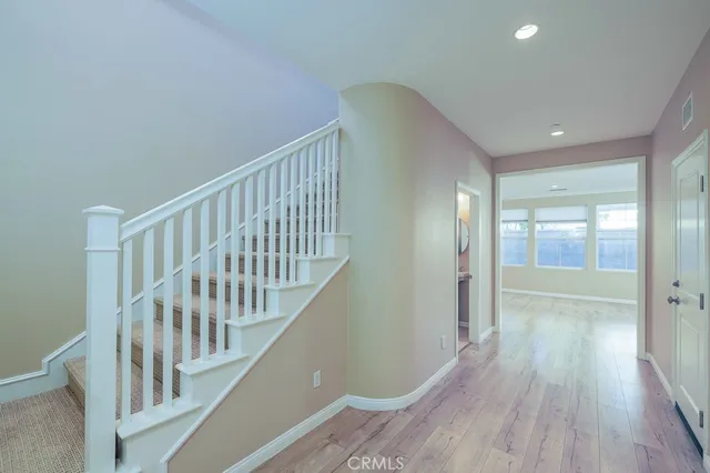 a view of entryway with wooden floor