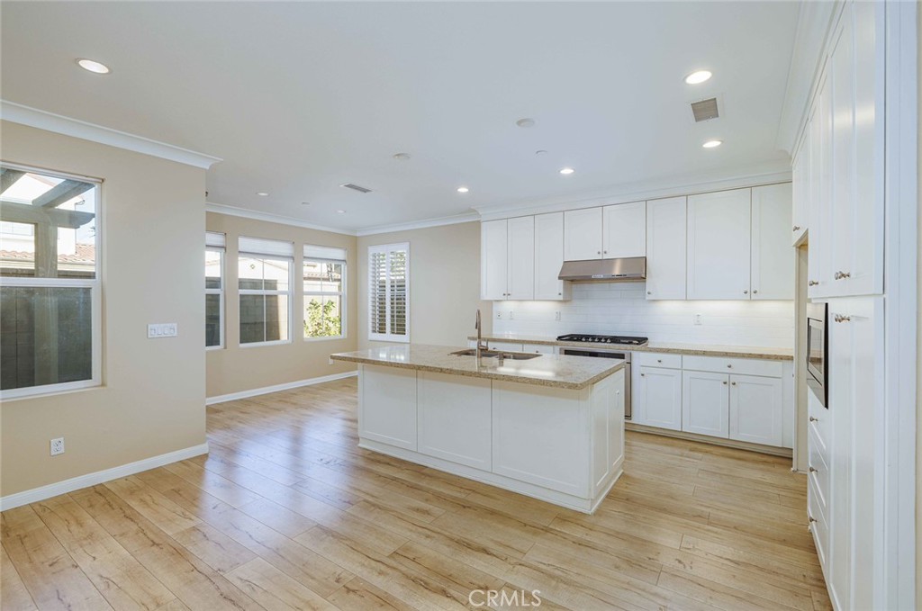 125 Waterleaf Irvine, CA 92620 - Photo 8 of 20 a kitchen with stainless steel appliances granite countertop a stove a sink and a refrigerator