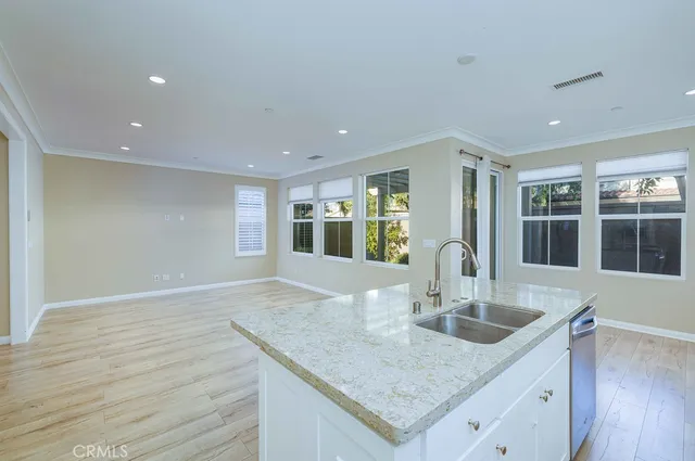 a kitchen with granite countertop a sink and center island