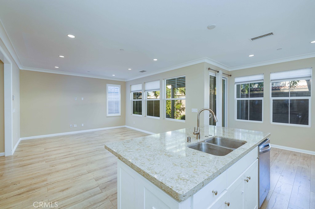 125 Waterleaf Irvine, CA 92620 - Photo 10 of 20 a kitchen with granite countertop a sink and center island
