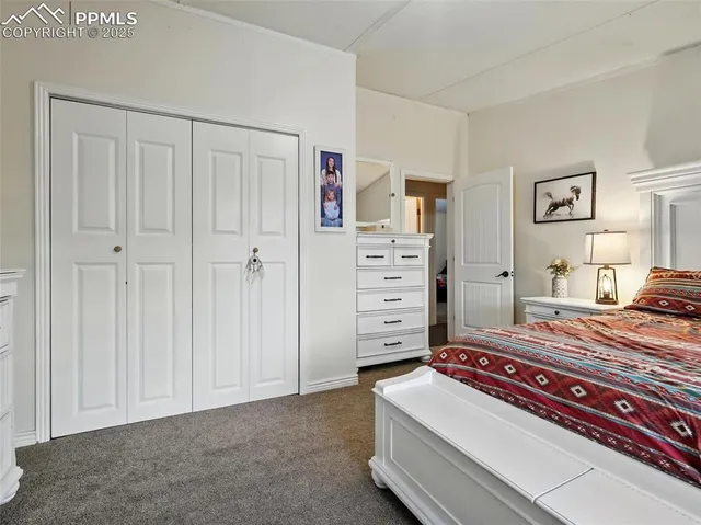 a bedroom with furniture and lamp