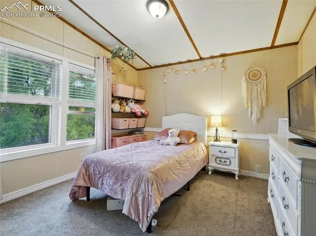 a bed room with a bed and a window