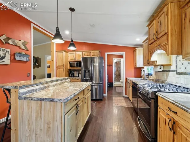 a kitchen with stainless steel appliances granite countertop counter space a sink and cabinets