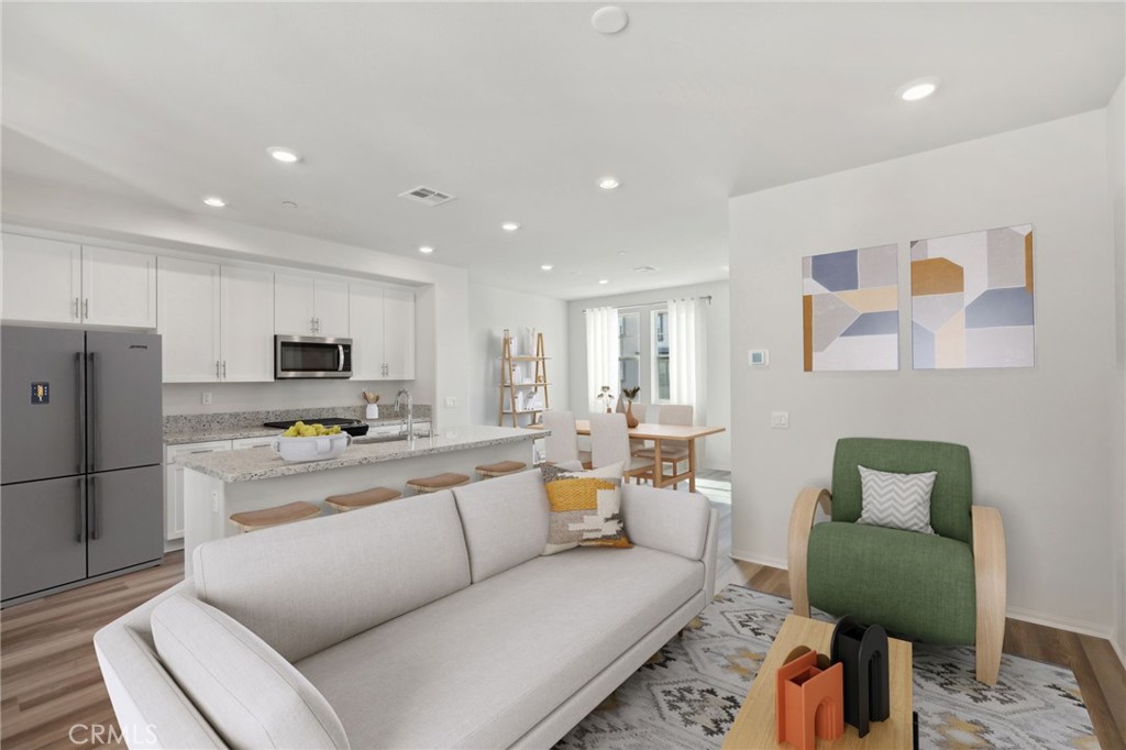 28022 Melrose Drive Temecula, CA 92591 - Photo 11 of 35 a living room with furniture and a refrigerator