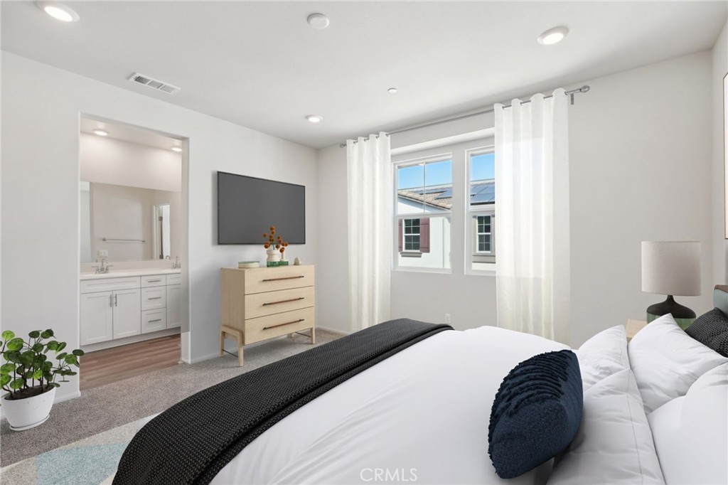 28022 Melrose Drive Temecula, CA 92591 - Photo 23 of 35 a bedroom with a bed and a flat screen tv