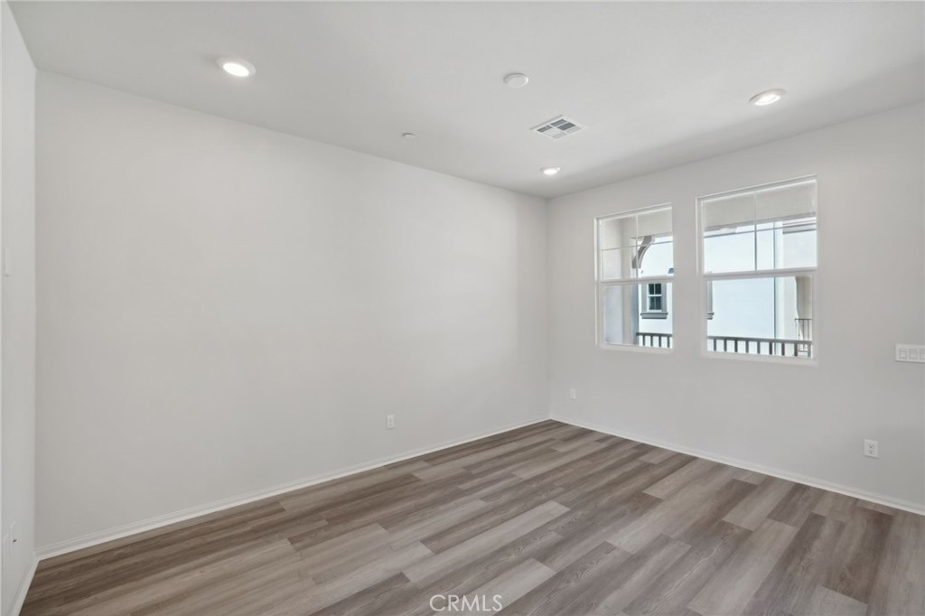 28022 Melrose Drive Temecula, CA 92591 - Photo 25 of 35 a view of empty room with wooden floor and fan