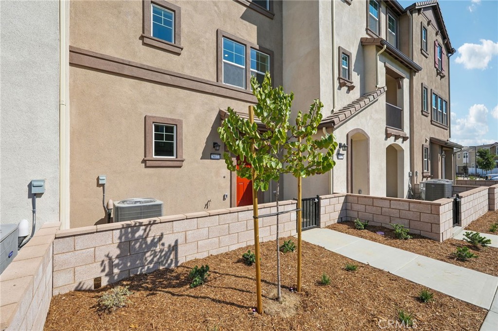 28022 Melrose Drive Temecula, CA 92591 - Photo 3 of 35 a front view of a house with a yard