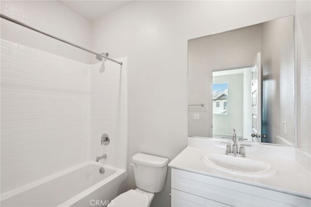 28022 Melrose Drive Temecula, CA 92591 - Photo 31 of 35 a bathroom with a sink toilet and shower