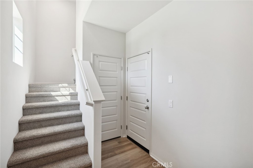 28022 Melrose Drive Temecula, CA 92591 - Photo 7 of 35 a view of entryway with wooden floor and stairs