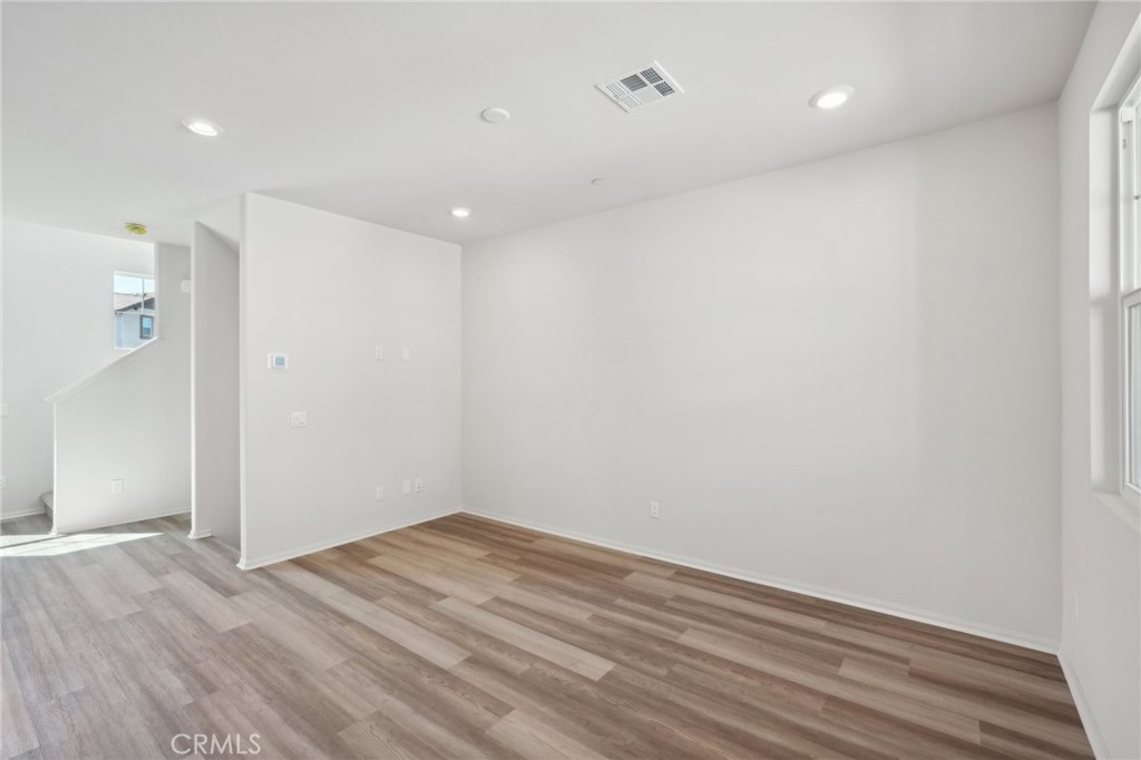 28022 Melrose Drive Temecula, CA 92591 - Photo 9 of 35 a view of room with wooden floor and windows