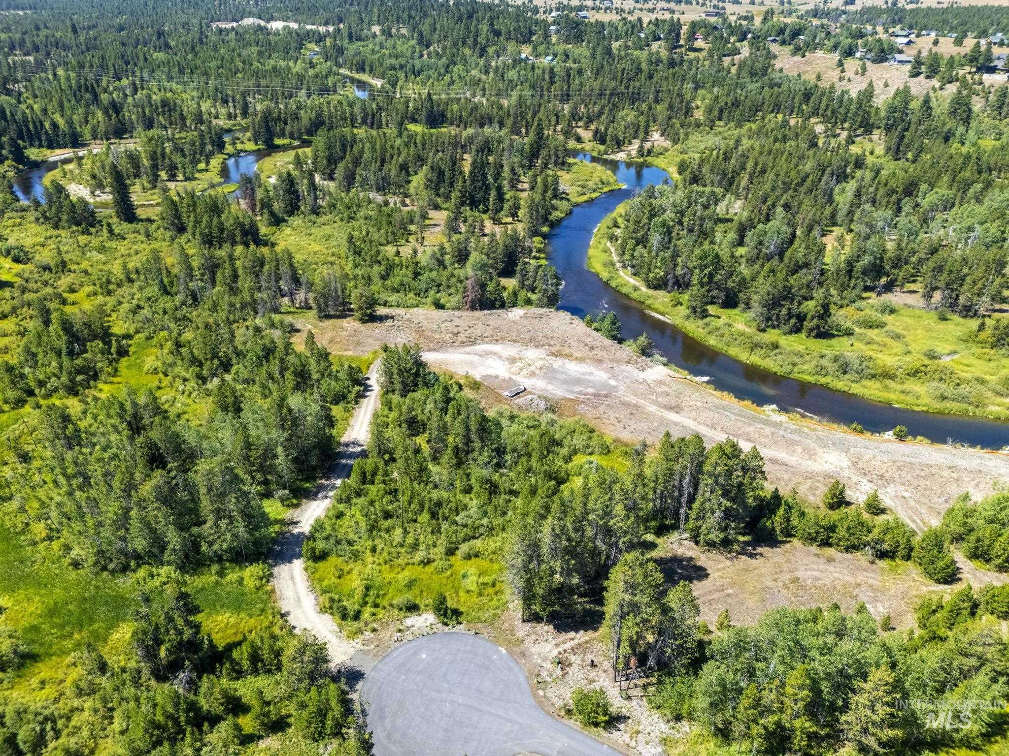 64 River Run Court McCall, ID 83638 - Photo 6 of 7 Drone / aerial view of a large body of water and a heavily wooded area