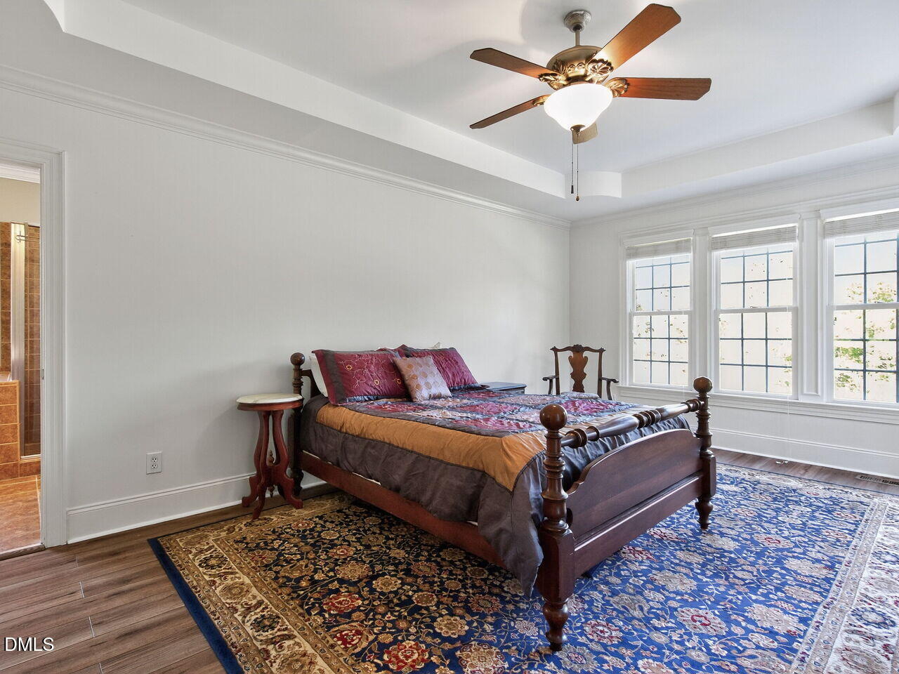 260 Marcellus Way Clayton, NC 27527 - Photo 17 of 47 a living room with a bed furniture and a window