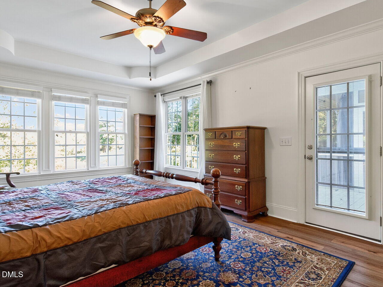 260 Marcellus Way Clayton, NC 27527 - Photo 18 of 47 a bedroom with a bed and a window