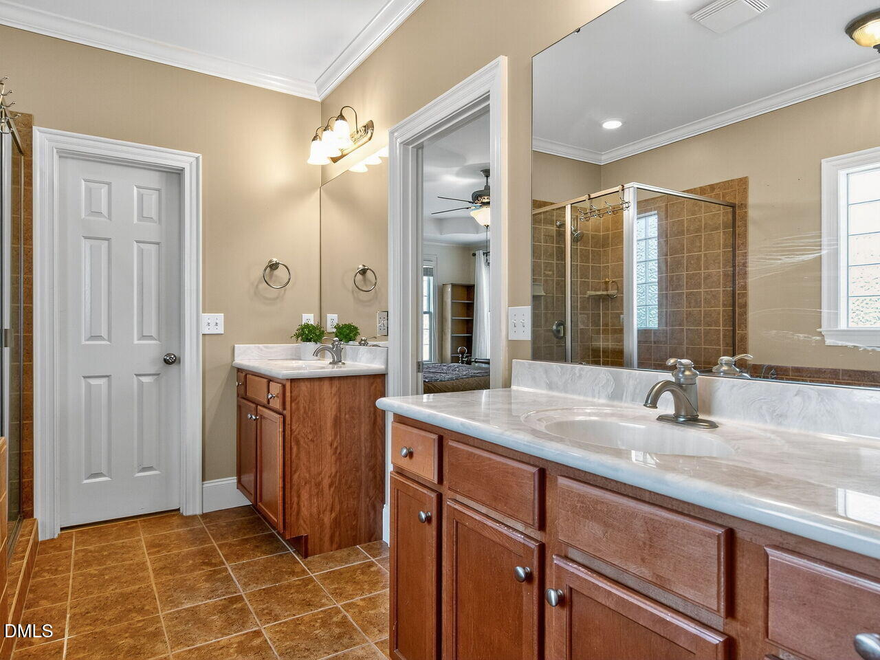 260 Marcellus Way Clayton, NC 27527 - Photo 19 of 47 a bathroom with a granite countertop sink a mirror and a shower