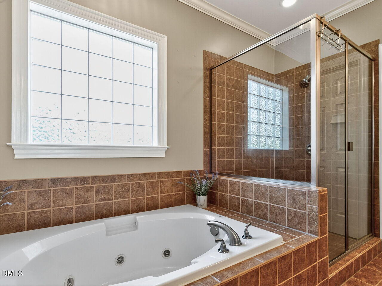 260 Marcellus Way Clayton, NC 27527 - Photo 20 of 47 a bathroom with a bathtub and shower