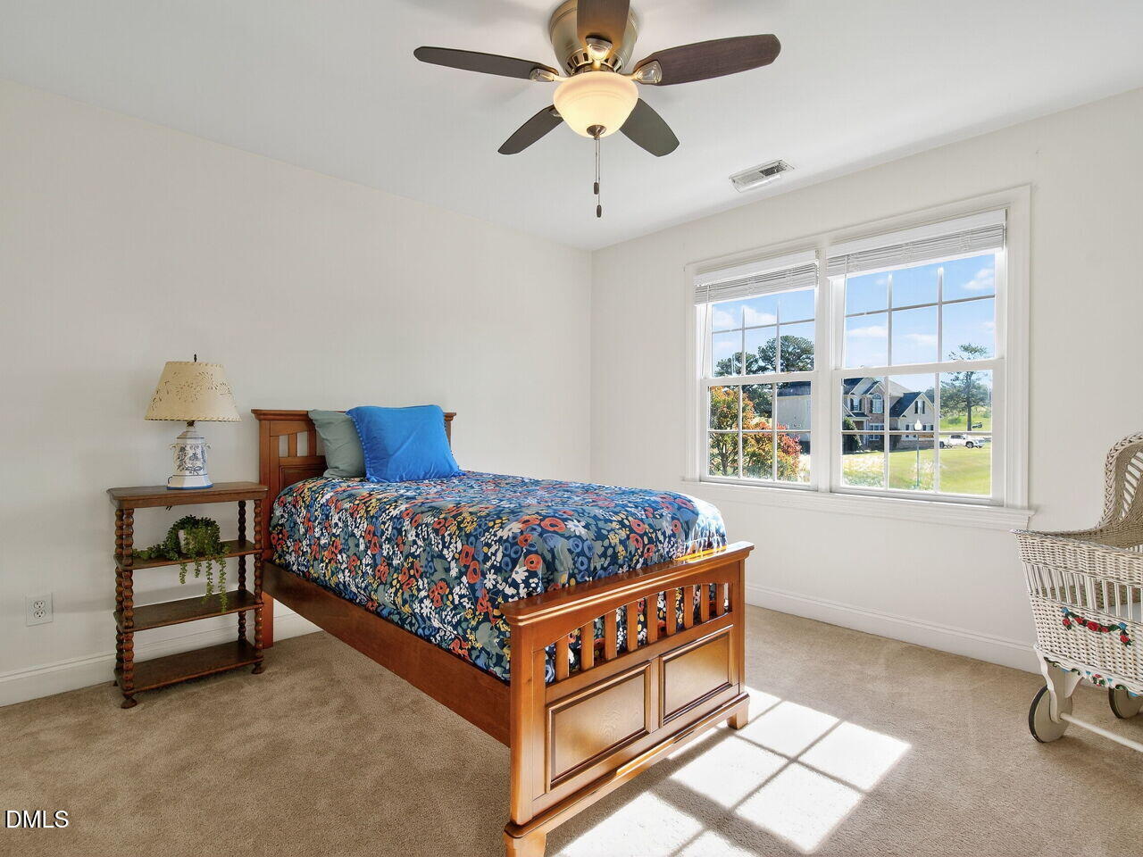 260 Marcellus Way Clayton, NC 27527 - Photo 27 of 47 a bedroom with a bed and a window