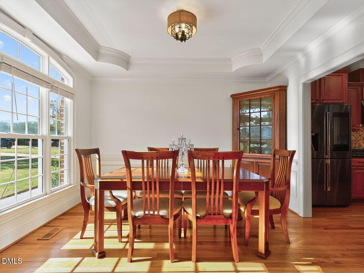 260 Marcellus Way Clayton, NC 27527 - Photo 6 of 47 a view of a dining room with furniture and wooden floor