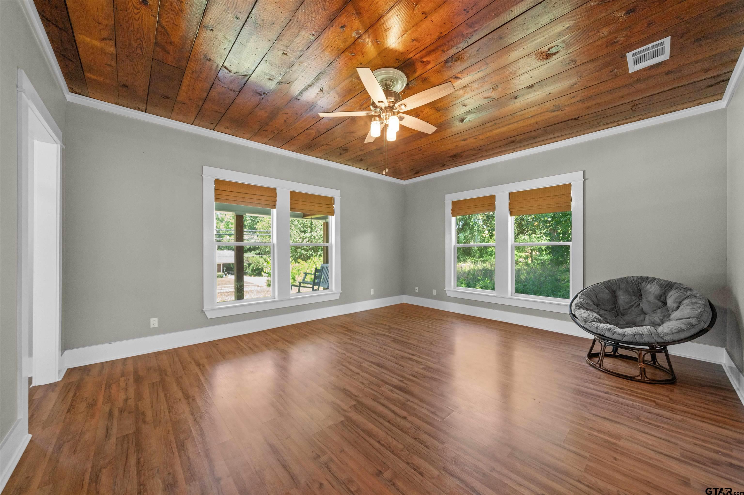 230 North Henderson Street Rusk, TX 75785 - Photo 15 of 34 a view of an empty room with wooden floor and a window