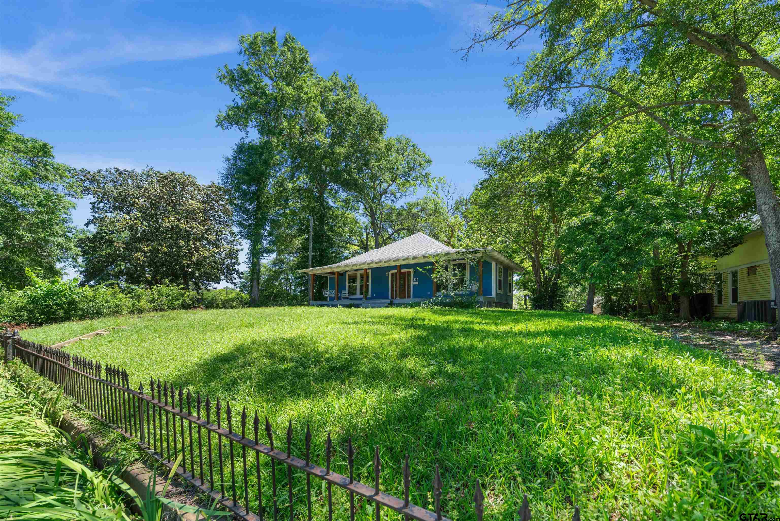 230 North Henderson Street Rusk, TX 75785 - Photo 2 of 34 a view of a big yard with plants and large trees