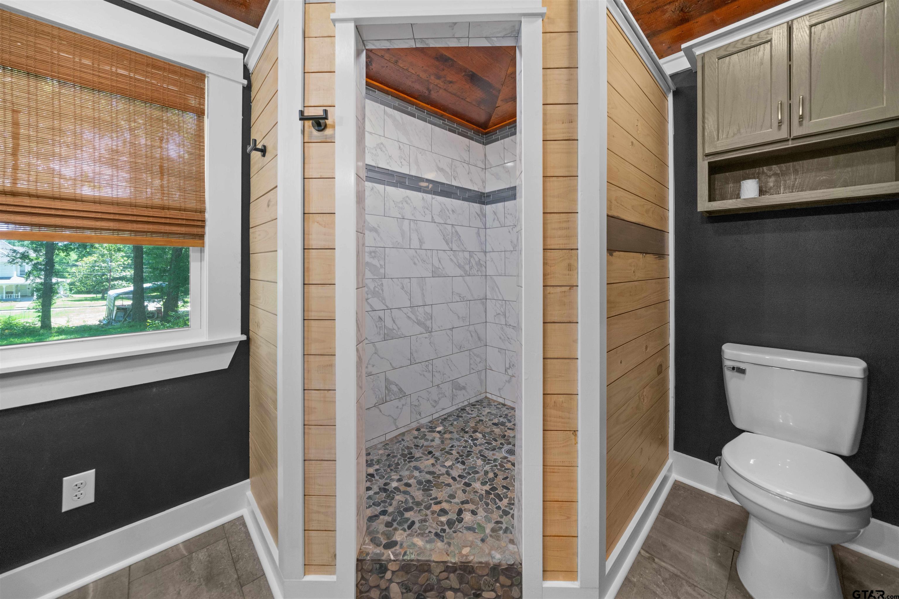 230 North Henderson Street Rusk, TX 75785 - Photo 24 of 34 a bathroom with a toilet and a shower