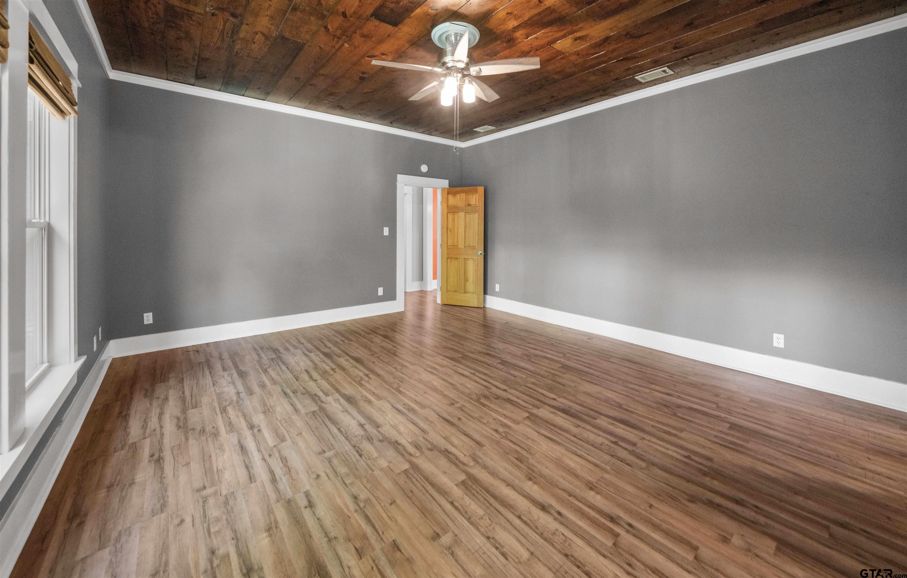 230 North Henderson Street Rusk, TX 75785 - Photo 28 of 34 a view of an empty room with window and wooden floor