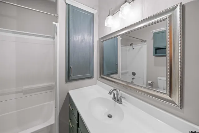 a big yard with lots of green space and trees